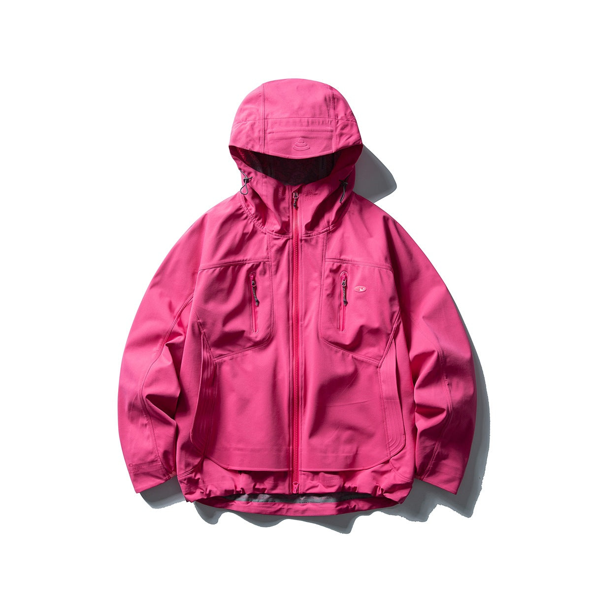 Bright raspberry pink hooded zip jacket with zipped chest pockets and a curved layered hem, flat lay