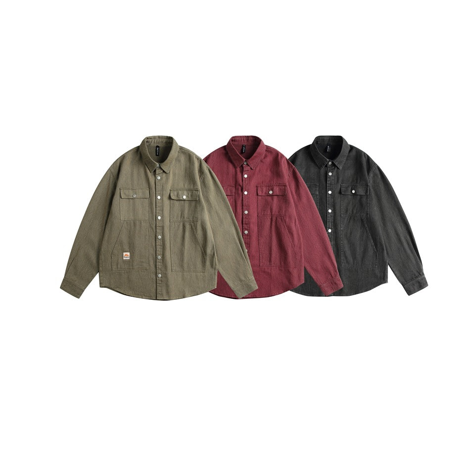 Three button-up overshirts with flap chest pockets shown together in olive-brown, muted red, and charcoal.