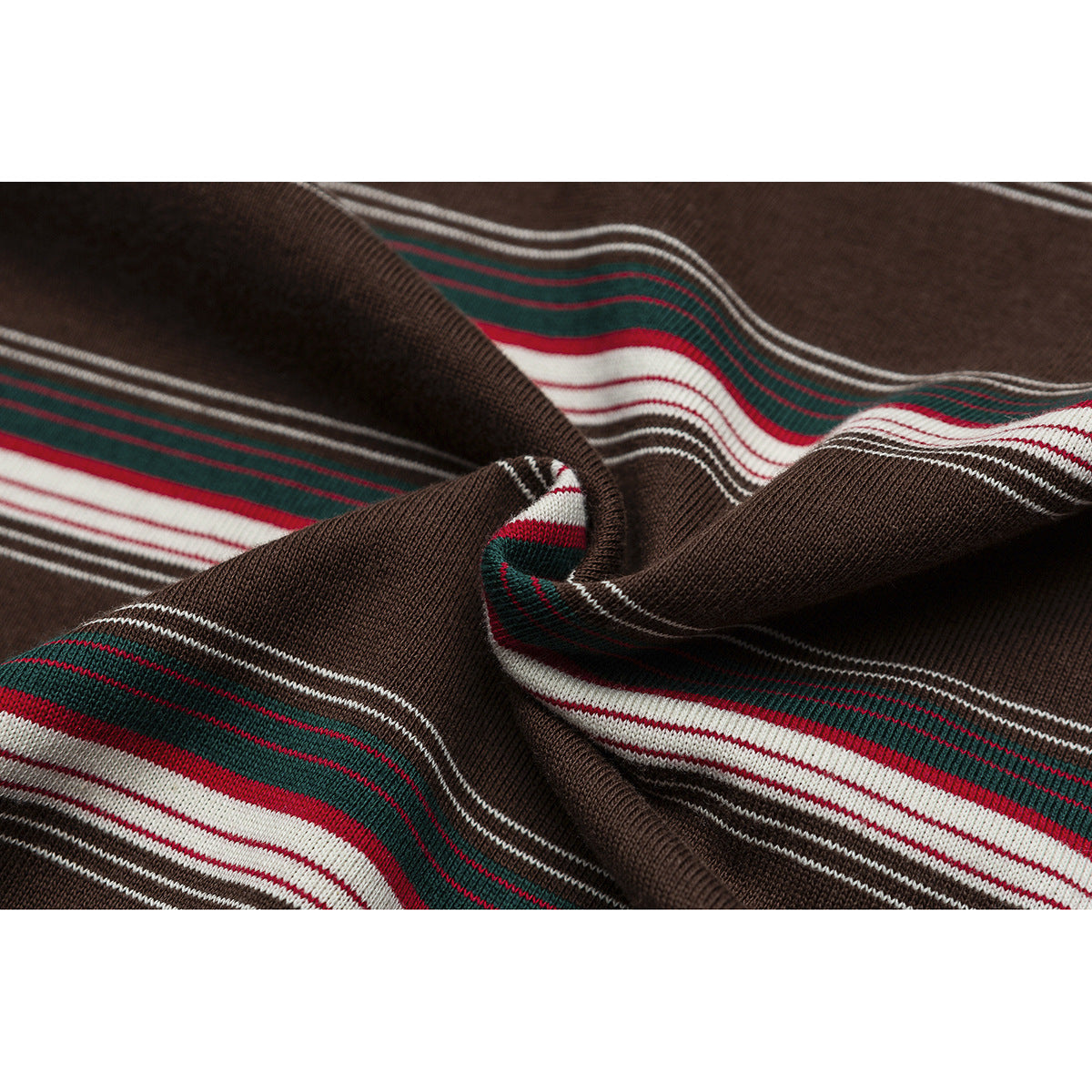 Close-up of brown knit fabric with red, green, and white stripes, gathered into folds.