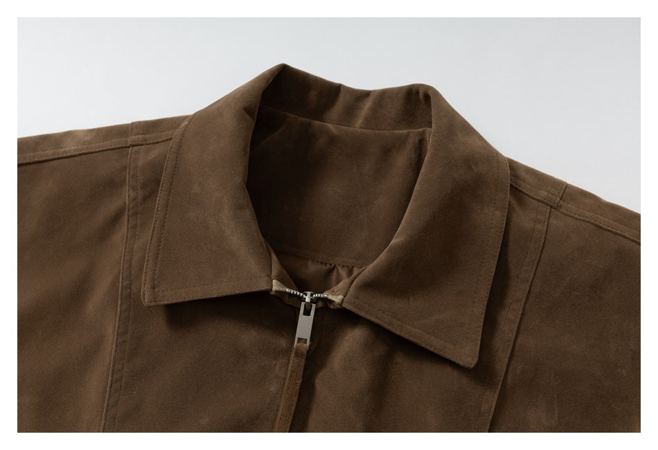 Close-up of the brown jacket's wide collar and upper front zipper.
