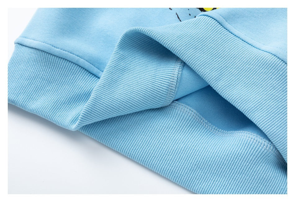 Close-up of light blue ribbed garment edges and stitching, showing the inside seam.