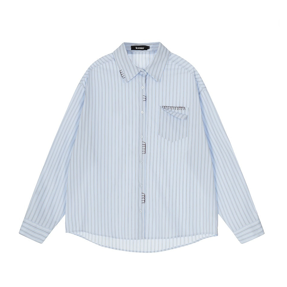 Light blue striped long-sleeve button-up shirt, front flat lay, with chest pocket and black stitch details