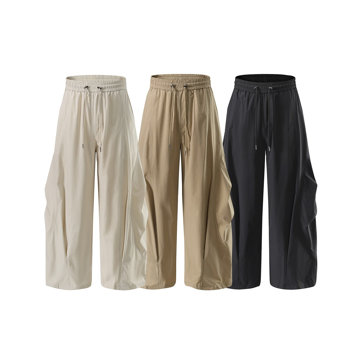 Three pairs of wide-leg drawstring pants shown from the front in off-white, tan, and charcoal.