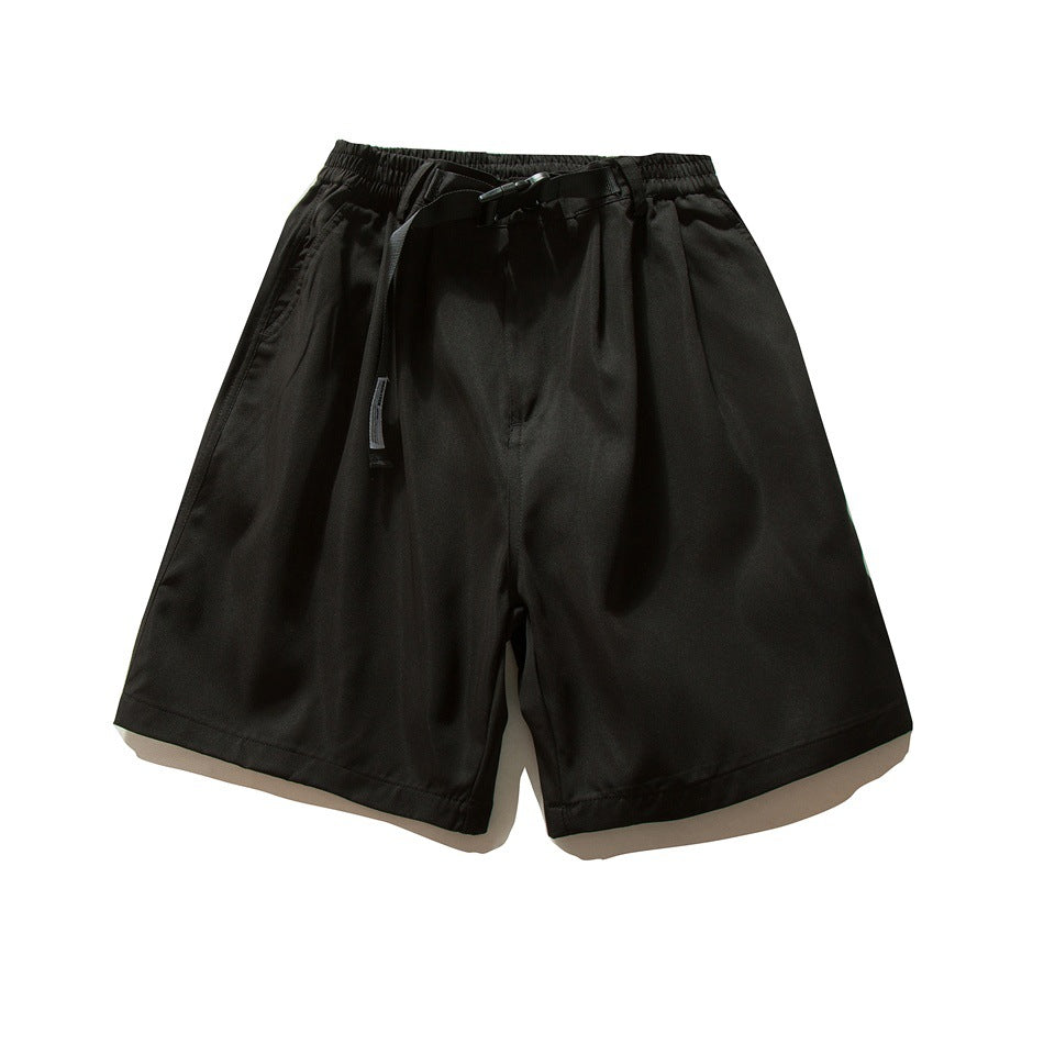 Black knee-length wide-leg shorts flat lay with elastic waist, buckle belt, front pleats and side pockets