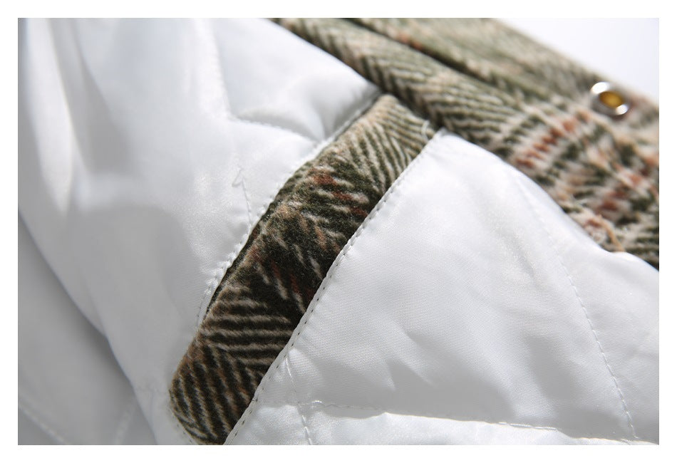 Close-up of white lining stitched to the plaid outer fabric.