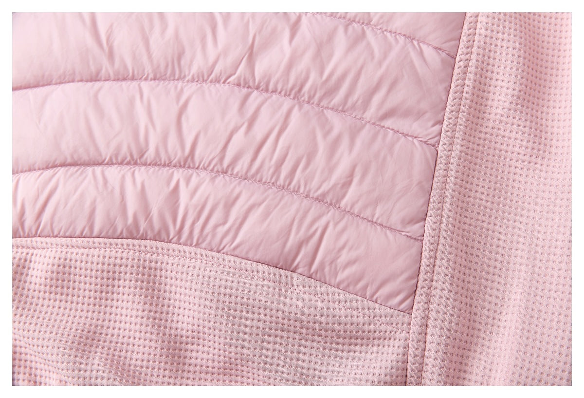 Close-up of pale pink jacket panels, with horizontal quilting beside textured fabric and stitched seams.