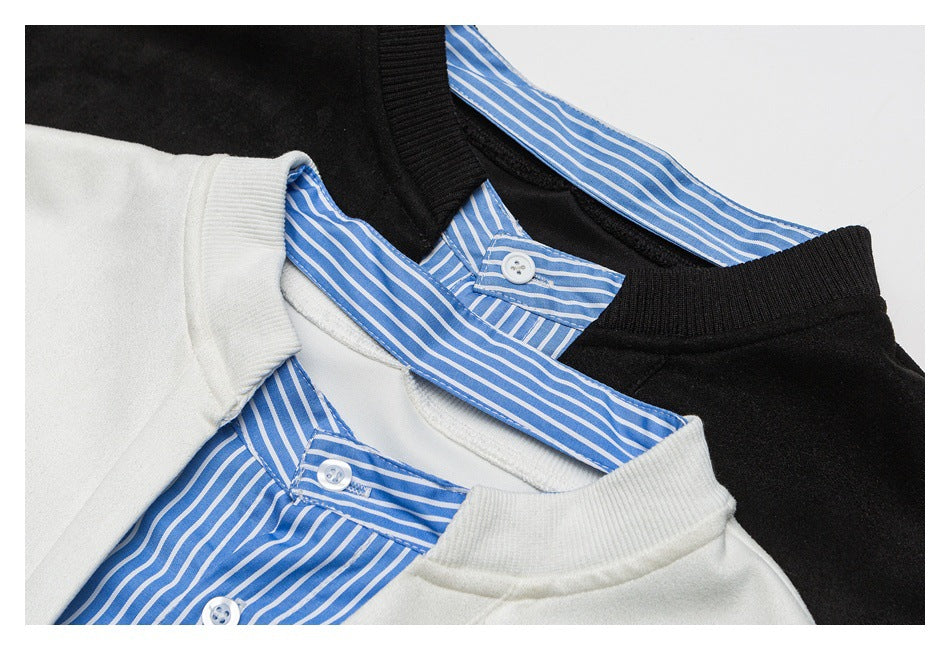 Close-up of black and off-white pullover necklines layered over blue-and-white striped button-up shirt collars.