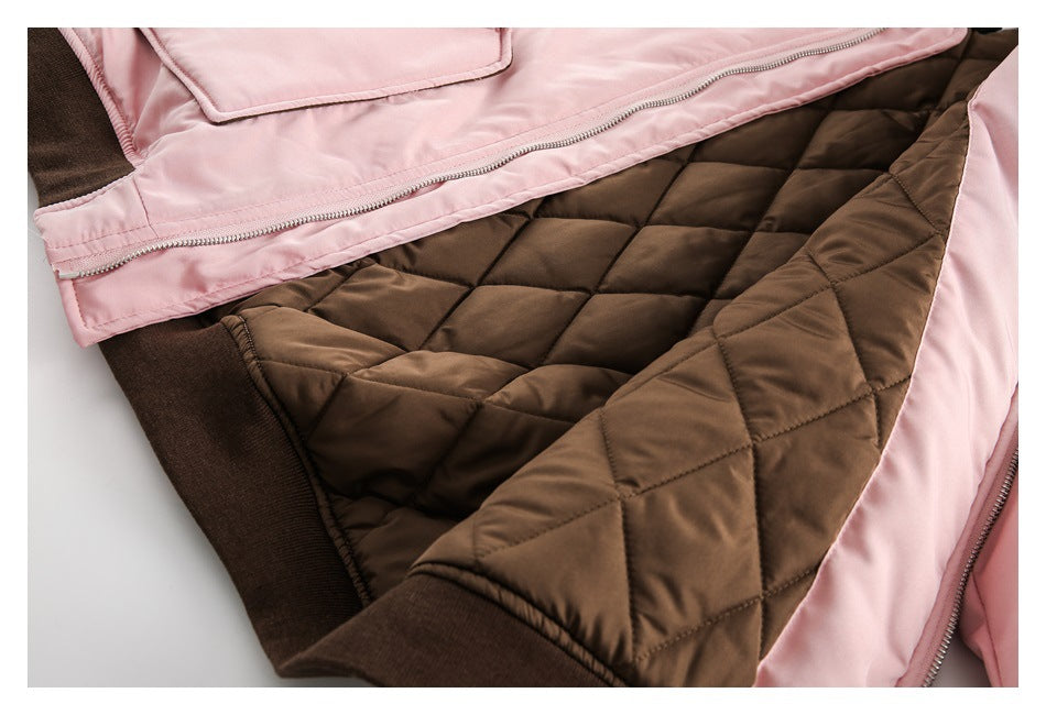 Open pale pink jacket showing dark brown diamond-quilted lining and ribbed trim.