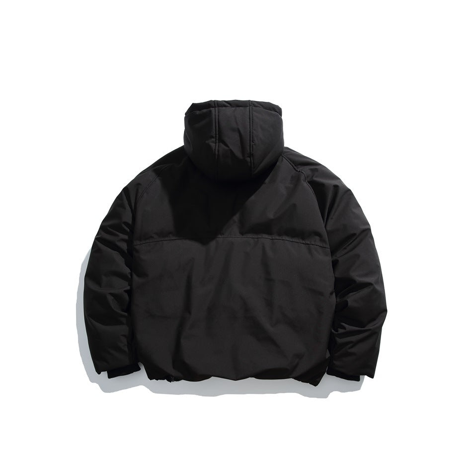 Back view of a black hooded jacket with long sleeves and a horizontal seam across the upper back.