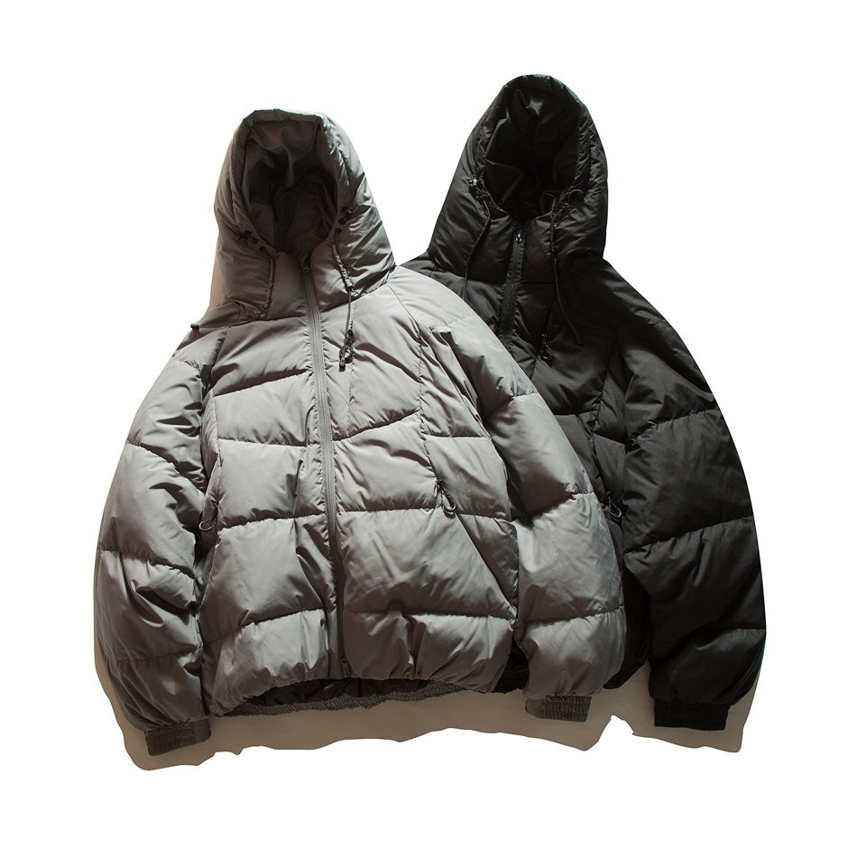 Gray and black hooded quilted puffer jackets laid flat side by side