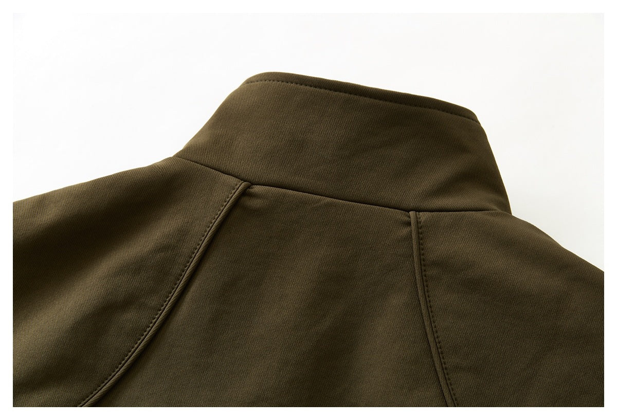Close-up of the olive-brown jacket's back collar and shoulder seams.