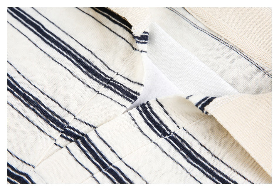 Close-up of the striped garment's neckline, showing the inner facing and cream collar.
