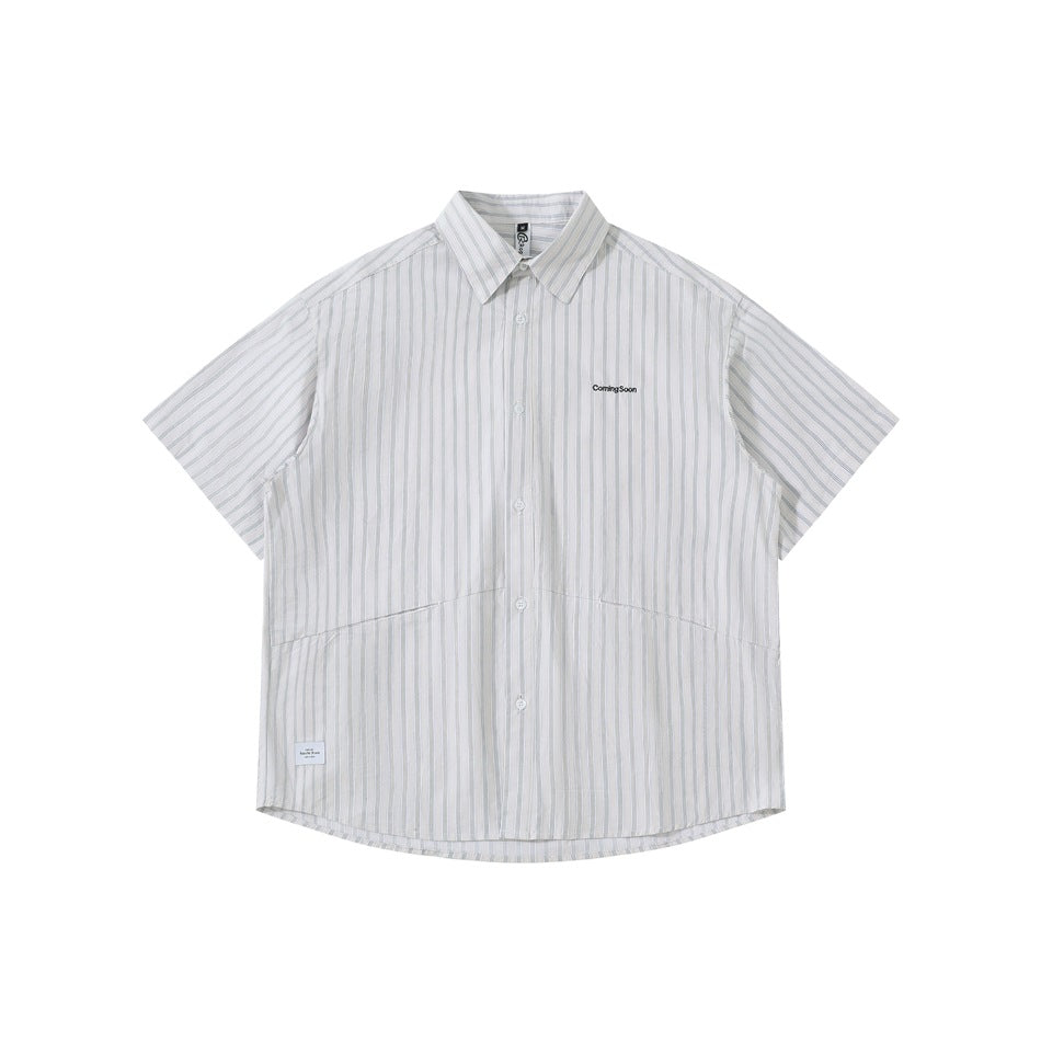 Gray-white vertical striped short-sleeve button-up shirt, front flat lay with small chest text and lower curved seams