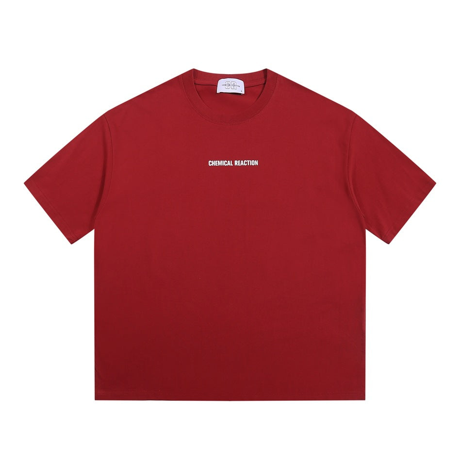 Red crew-neck short-sleeve T-shirt with small white CHEMICAL REACTION print at center chest, flat front view