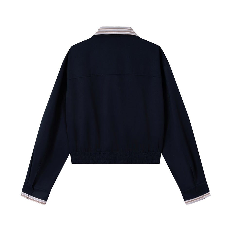 Back view of a dark navy jacket with a beige striped collar and cuffs and an elasticated hem.