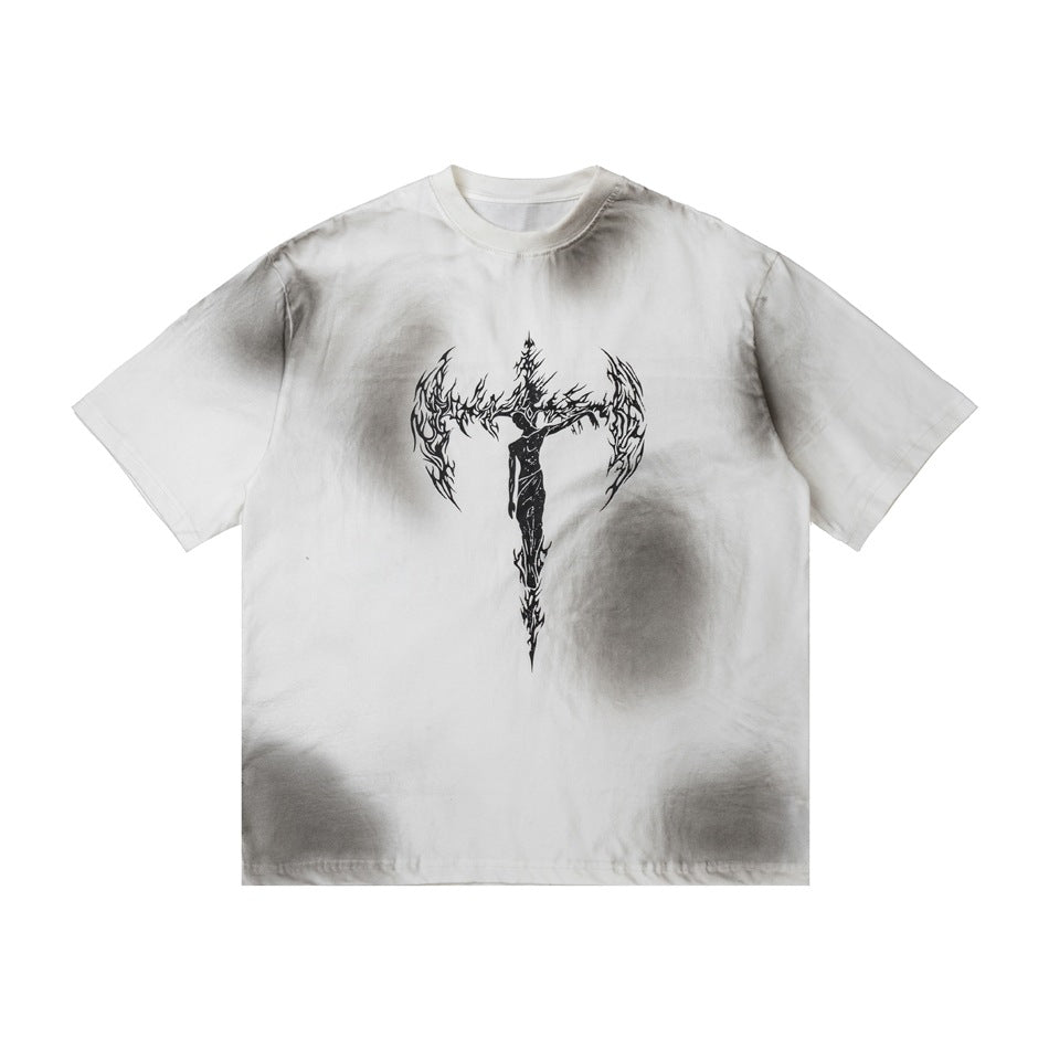 Off-white short-sleeve t-shirt with gray sprayed spots and a black winged cross figure graphic on the front