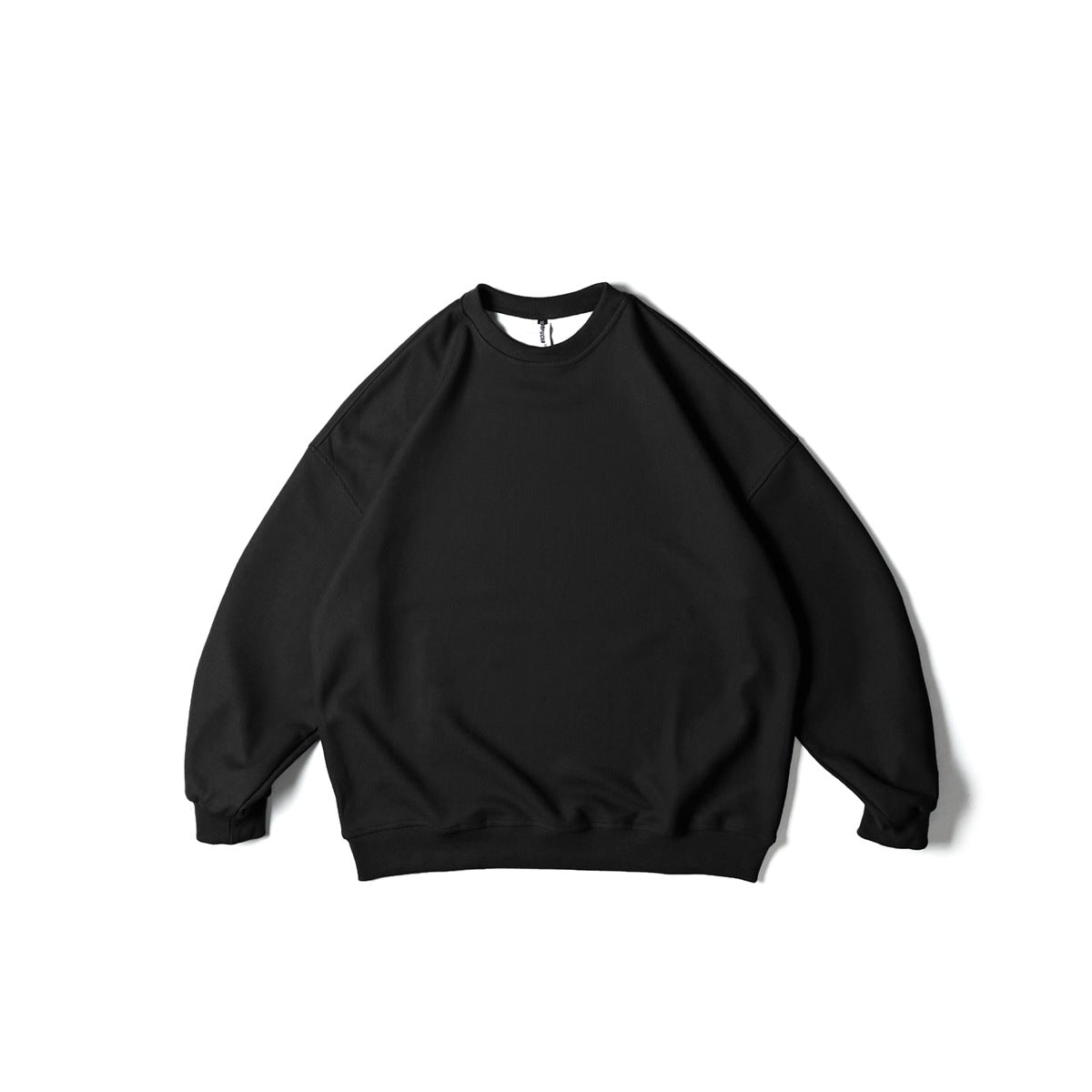 Black crew neck sweatshirt with drop shoulders and ribbed cuffs and hem, flat lay front view