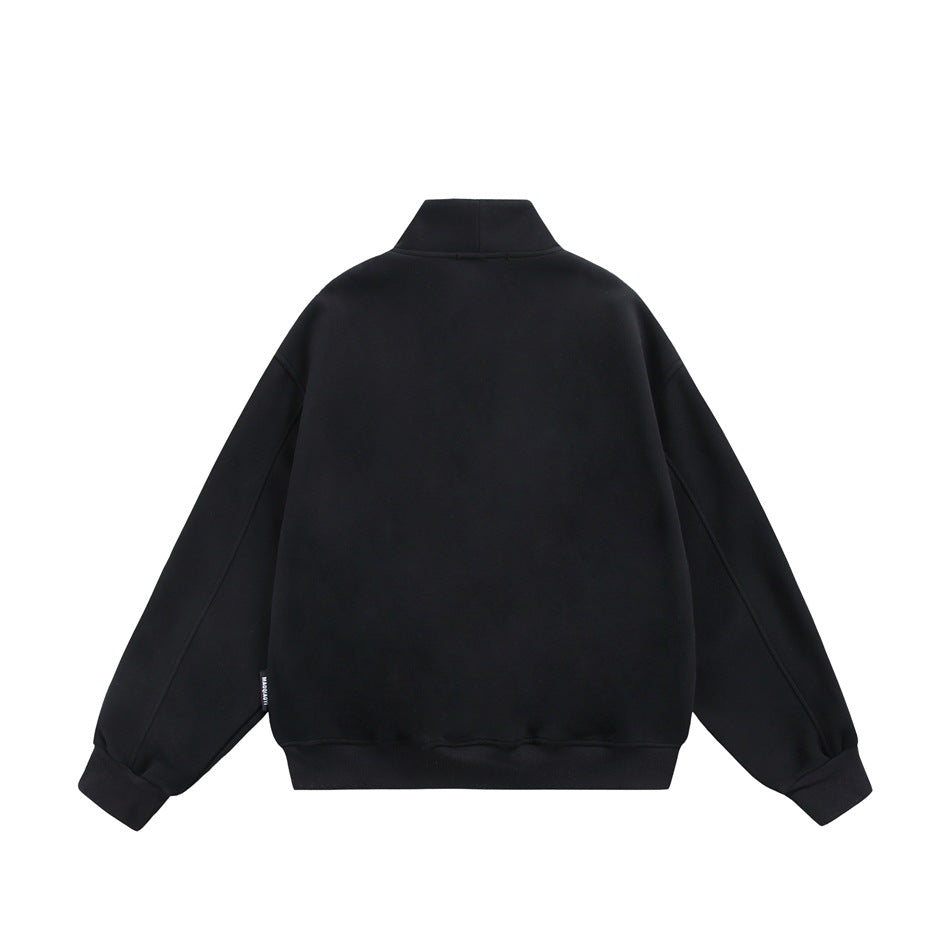 Back view of a plain black jacket with a stand collar, long sleeves, ribbed cuffs and hem.