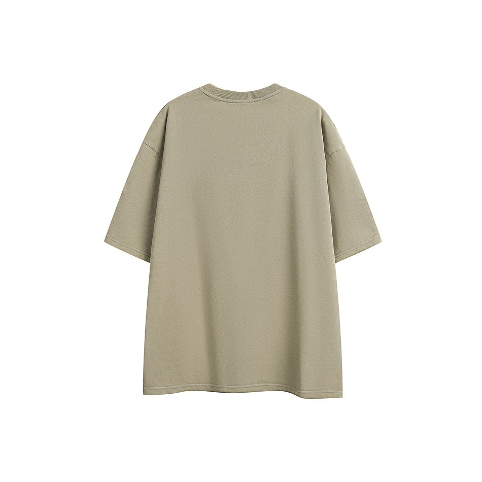 Plain oversized light khaki T-shirt shown from the back against a white background.