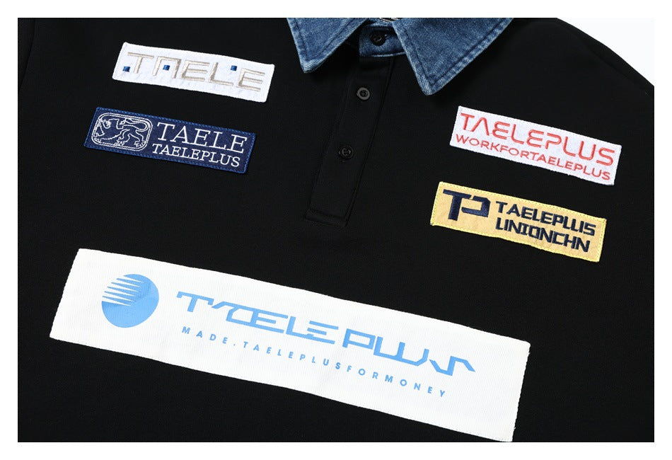 Black polo shirt chest with a blue collar and several colorful rectangular embroidered patches.