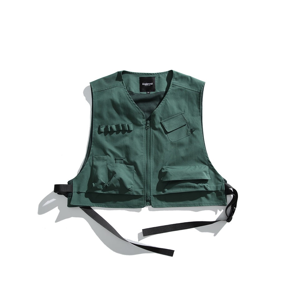 Army green sleeveless utility vest flat lay with front zipper, multiple pockets and black side straps