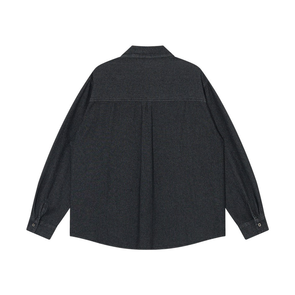 Back view of black textured denim-look long-sleeve shirt with back yoke seam and center pleat