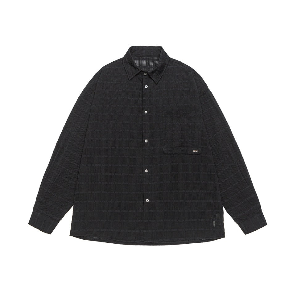 Black long-sleeve button-up shirt with textured tonal check pattern, chest pocket with flap and pointed collar, flat lay