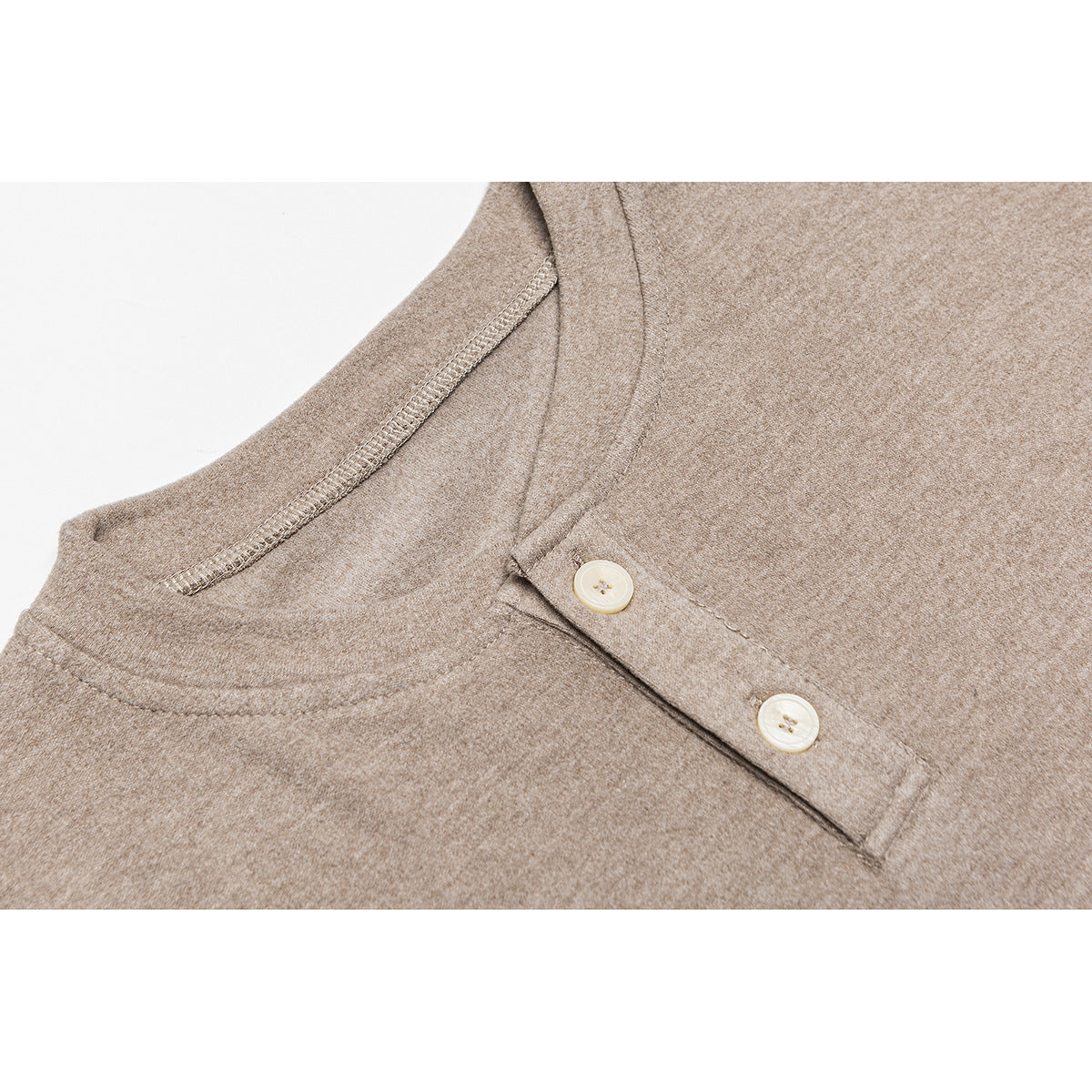 Close-up of a taupe long-sleeve shirt's round neckline and two-button placket.