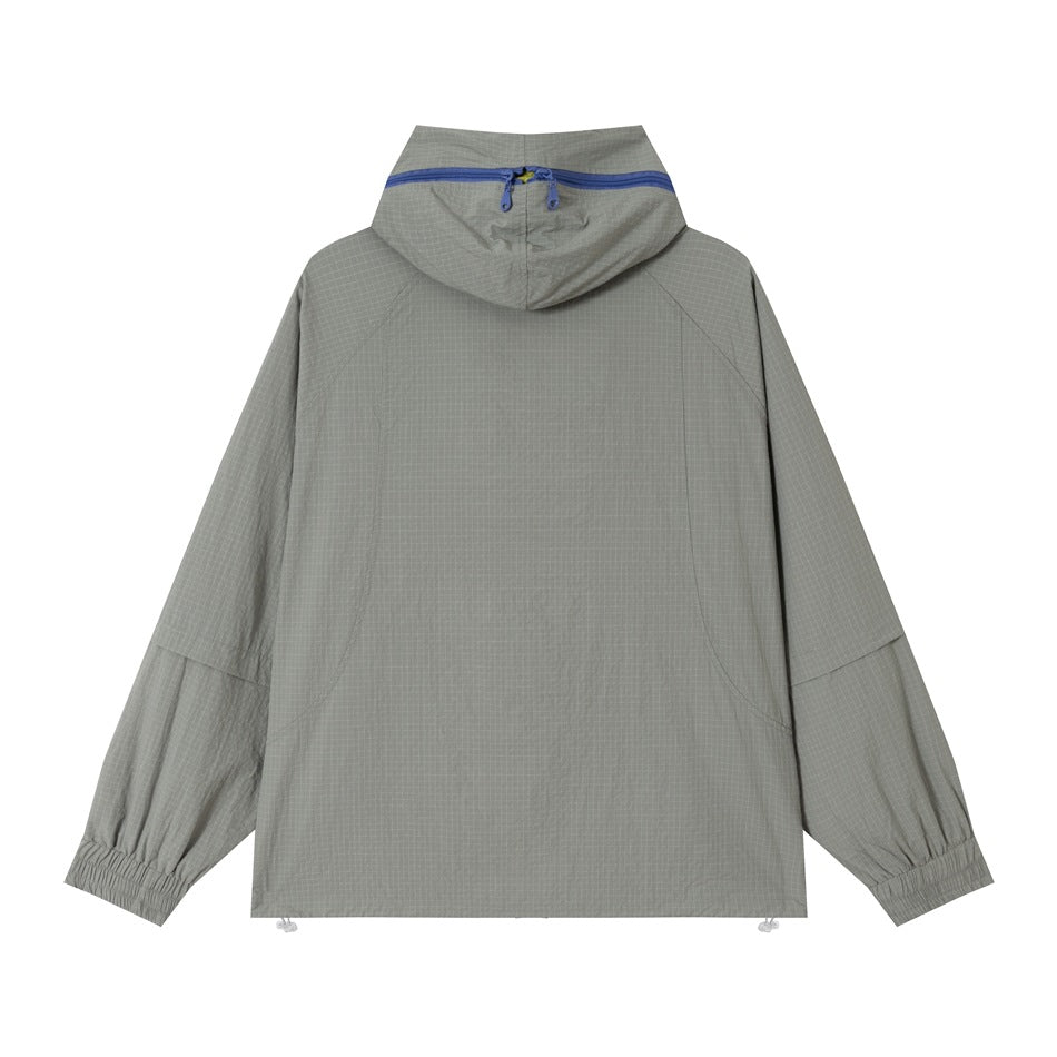 Back view of a gray hooded jacket with a blue zipper across the hood and gathered cuffs.