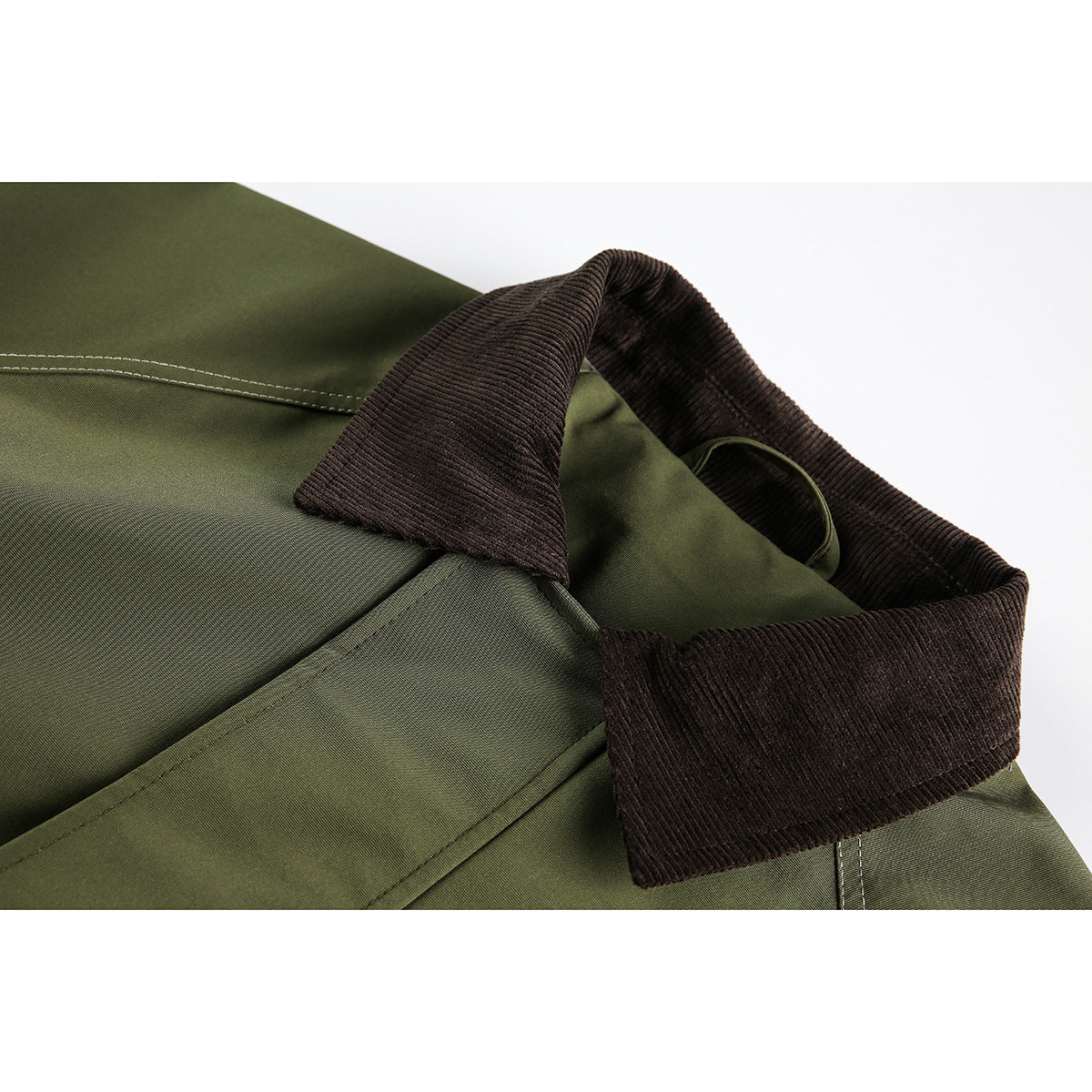 Close-up of an olive jacket with a wide dark brown ribbed collar and visible contrast stitching.