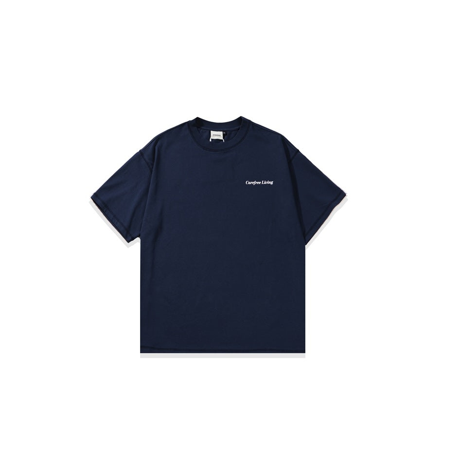 Navy short-sleeve crew-neck T-shirt, front view, with small white “Carefree Living” text on the chest.