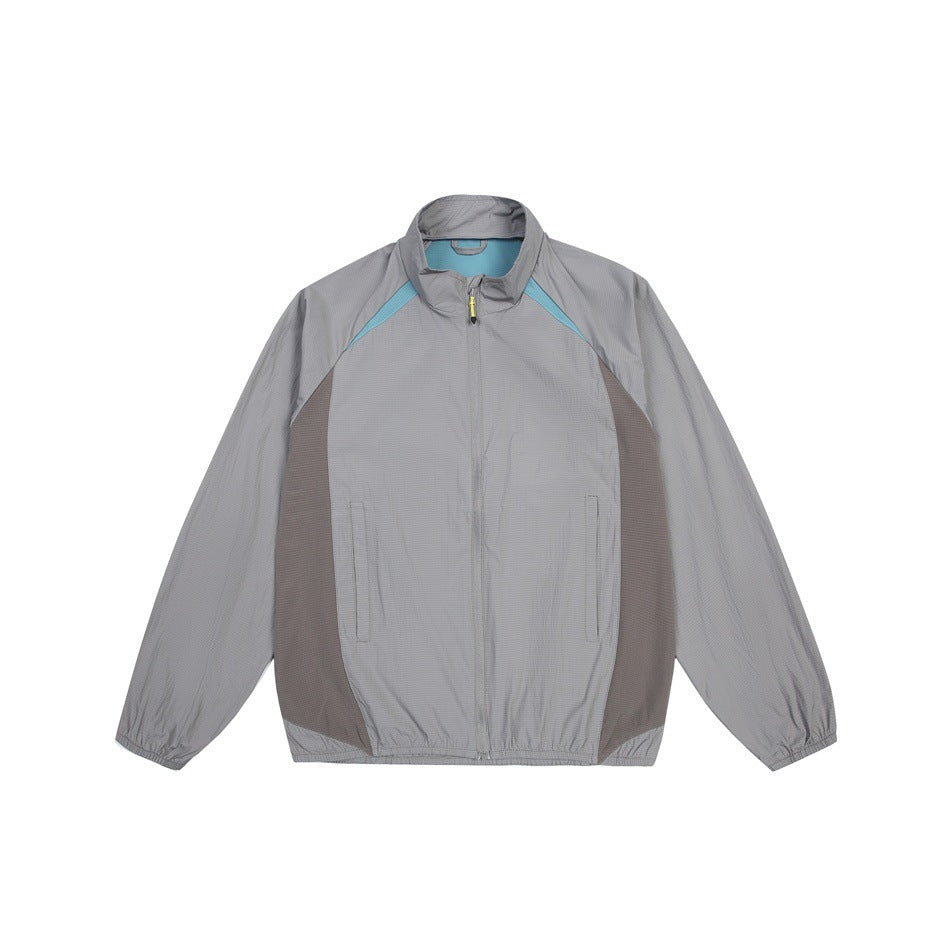Gray zip-up stand-collar jacket with teal shoulder trim and brown side panels, flat front view