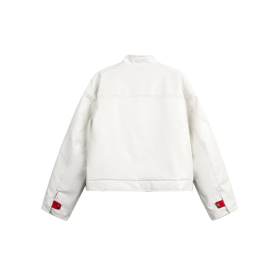 Back view of a white jacket with red stitching and red snap tabs at the cuffs.