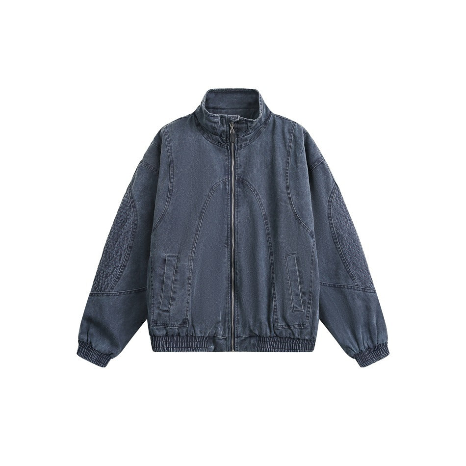 Front view of a dark blue zip-up jacket with a stand collar, curved seams, front pockets, and elastic cuffs and hem.