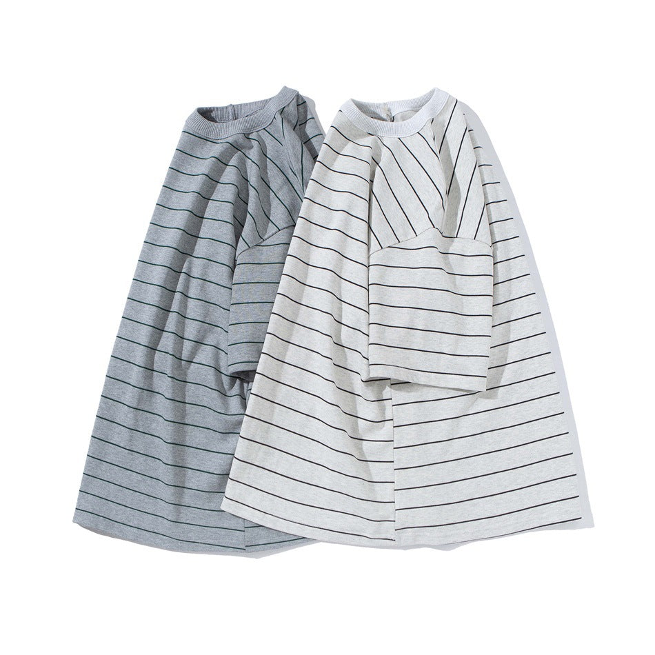 Two oversized striped crew-neck T-shirts shown flat: gray with green stripes and light gray with dark stripes.