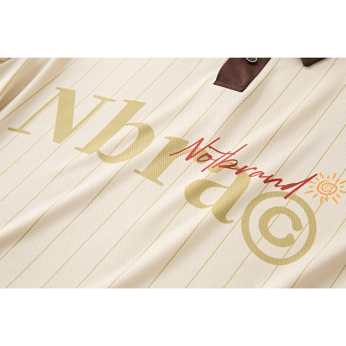 Close-up of cream pinstriped shirt fabric with a large tan and red printed graphic.
