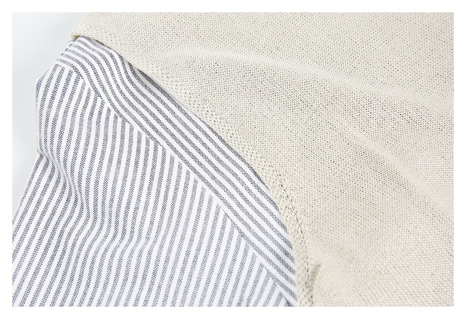 Close-up of cream open-knit fabric beside a white panel with narrow dark vertical stripes.