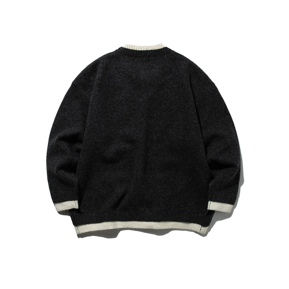 Back view of dark gray knit cardigan with cream ribbed collar, cuffs and hem