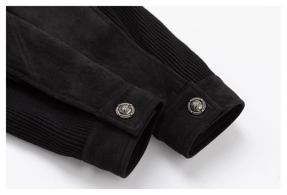 Close-up of two black garment cuffs with ribbed panels and decorative silver-tone buttons.