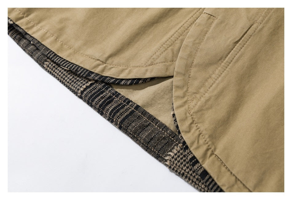 Close-up of a tan garment hem with black-and-tan patterned lining visible inside.