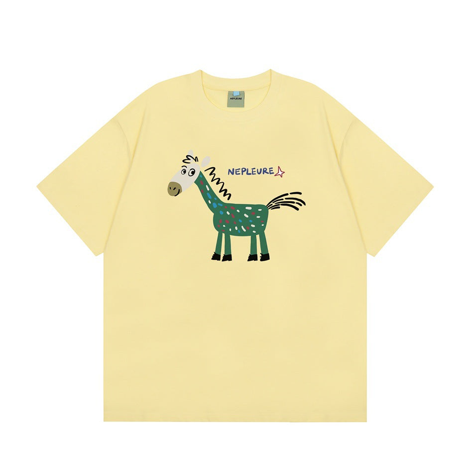 Light yellow short-sleeve crew-neck T-shirt with a speckled green cartoon horse graphic on the chest, flat view