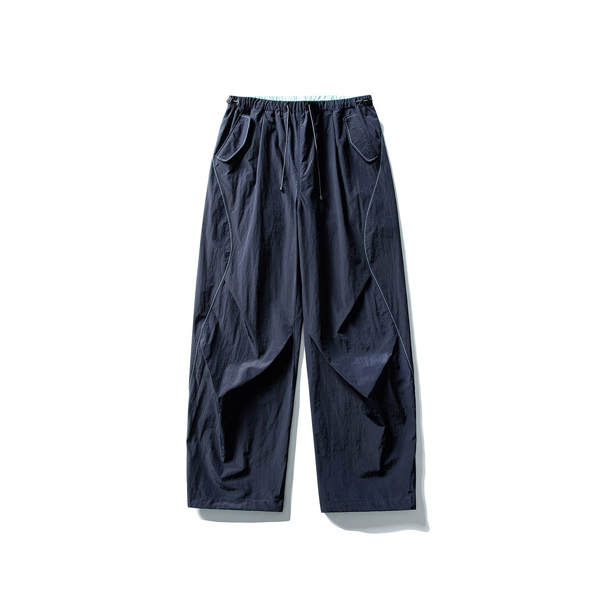 Dark navy wide-leg pants with light blue seam piping, drawstring waist and flap pockets, flat lay
