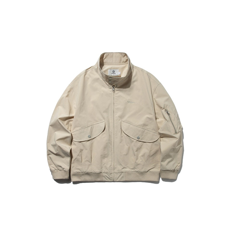 Khaki zip-front stand-collar jacket with two snap flap pockets, sleeve zip pocket and ribbed cuffs and hem, front view