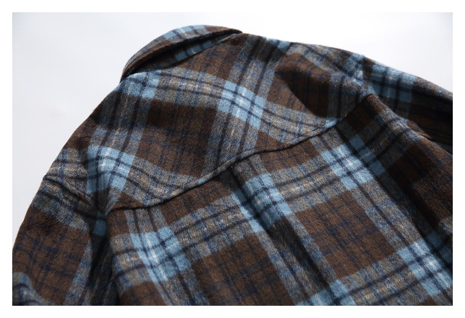 Close-up of the plaid shirt's back shoulder yoke and collar.
