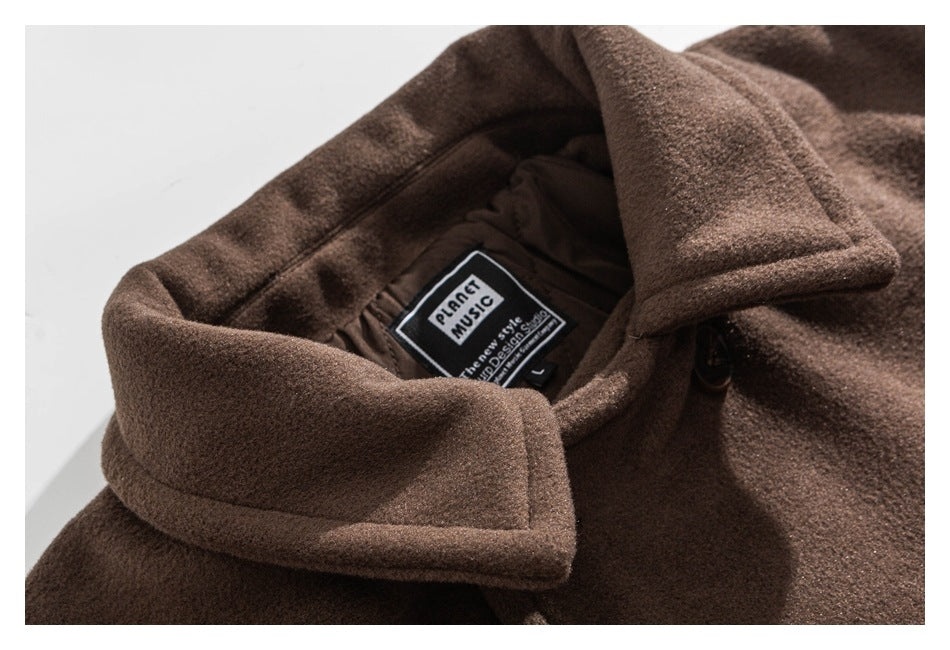 Close-up of a brown coat collar and interior brand label.
