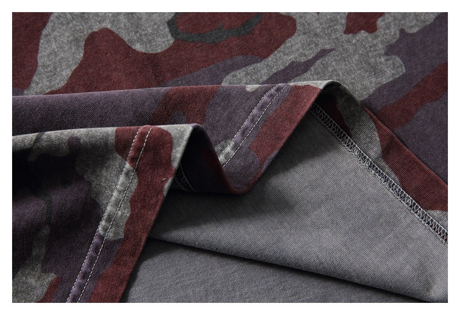 Close-up of the camouflage T-shirt's hem and inside overlock stitching.