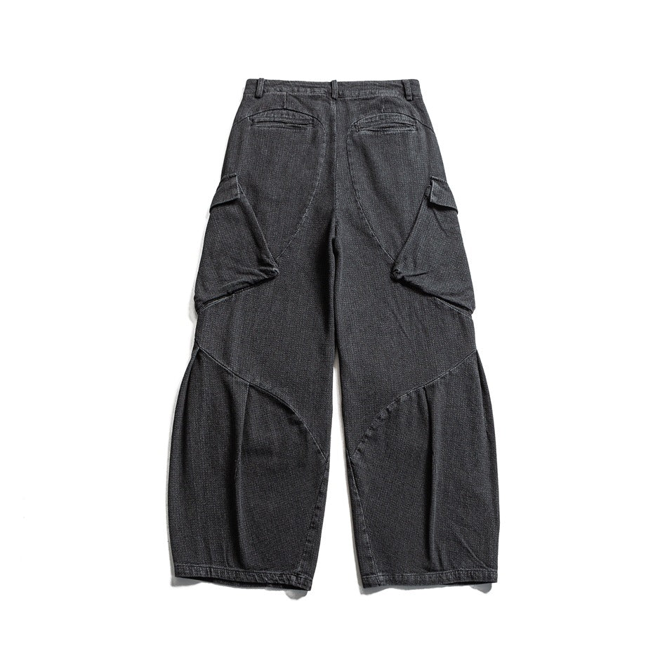Black wide-leg cargo pants back view with welt pockets, side cargo pockets and curved seams
