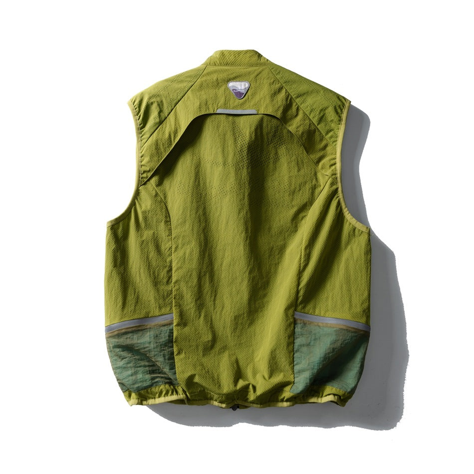 Back of a lime-green sleeveless vest with curved panels, reflective trim, and dark green lower sections.