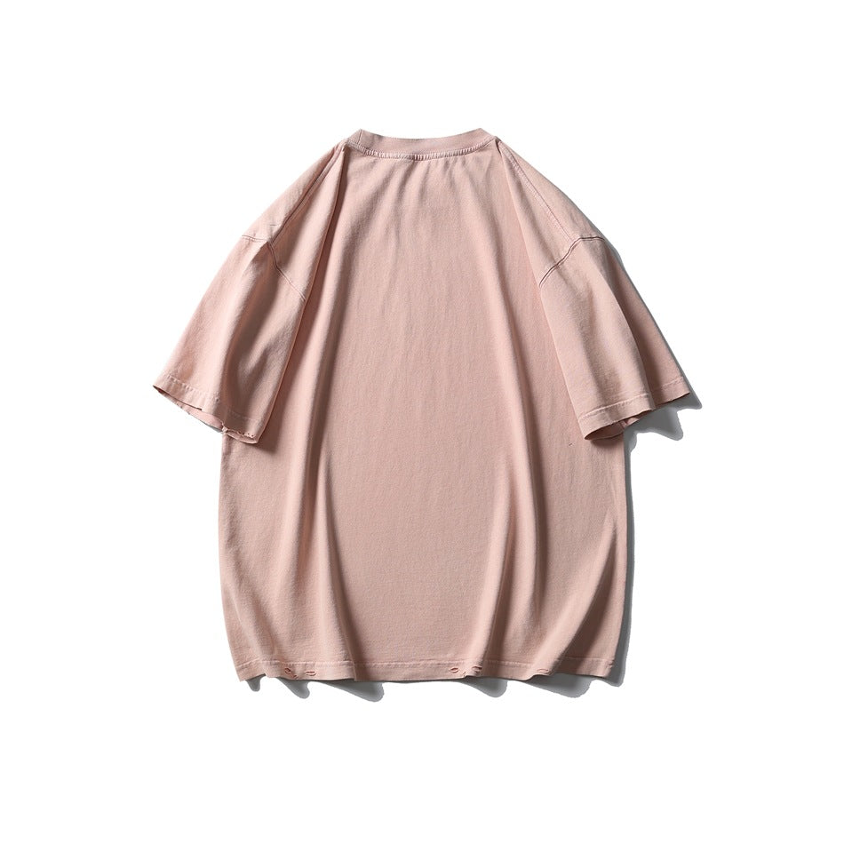 Back view of an oversized pale pink T-shirt with short sleeves and a plain design.