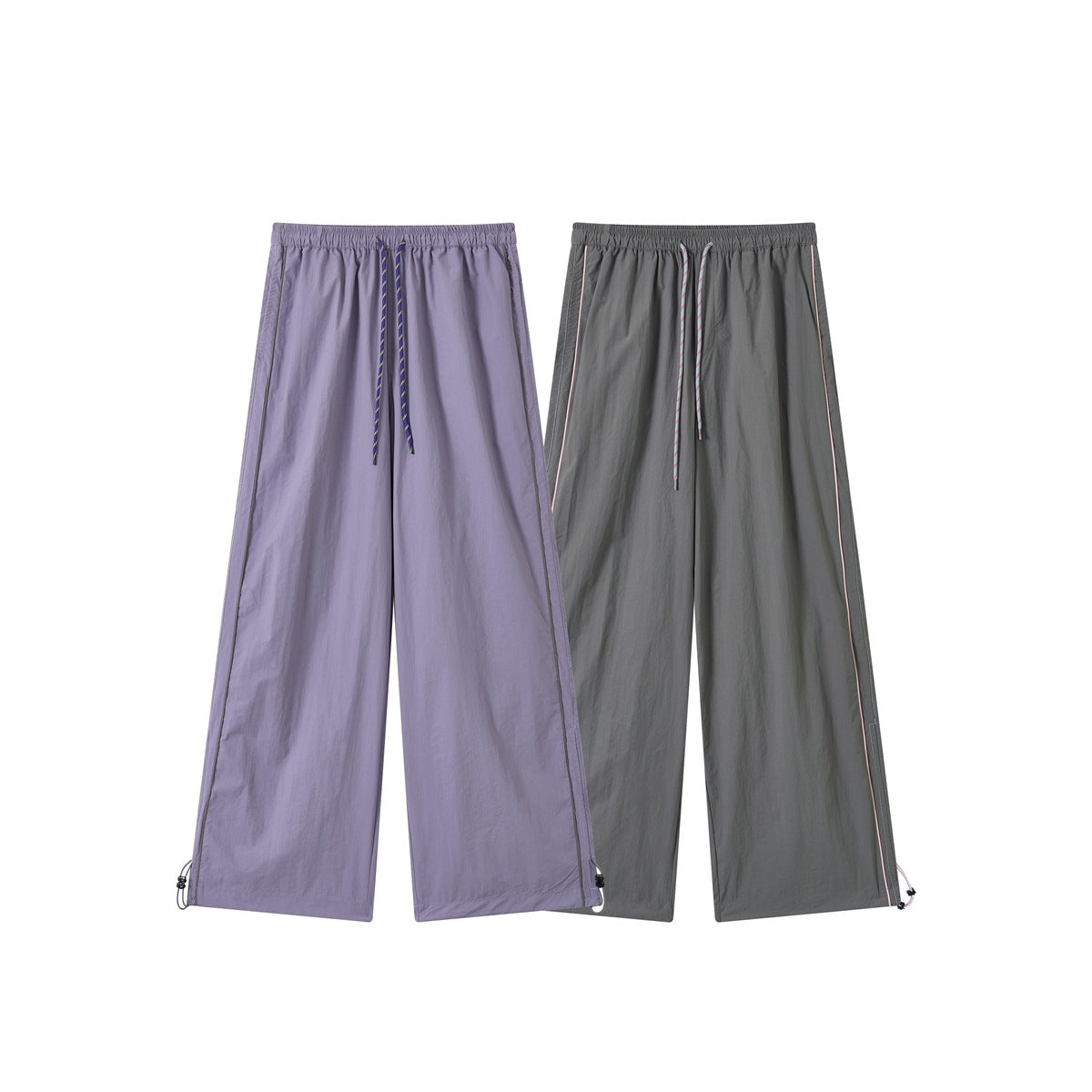 Front view of wide-leg drawstring pants in lavender and dark gray, with elastic waists, contrast piping, and adjustable hems.
